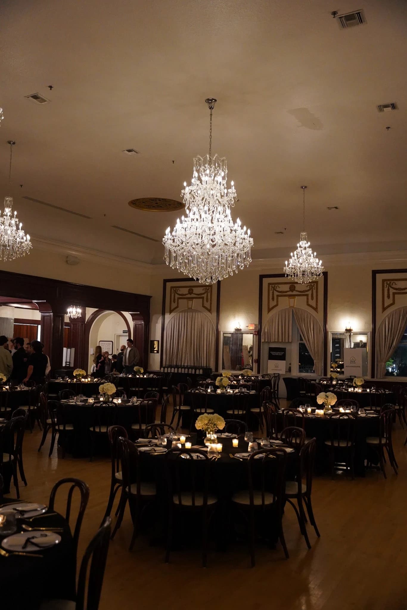 Elegant ballroom with crystal chandeliers at Advancers gathering